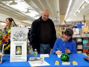 Author Kerry Gans signs book for a fan