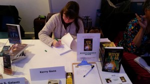 Author Kerry Gans signs books at an event