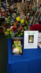 The Witch of Zal and flower arrangement at author Kerry Gans' book launch event