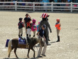 Child jockeys waiting to start the Shetland pony steeplechase